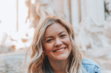 woman-smiling-wearing-denim-jacket.jpg woman smiling wearing denim jacket